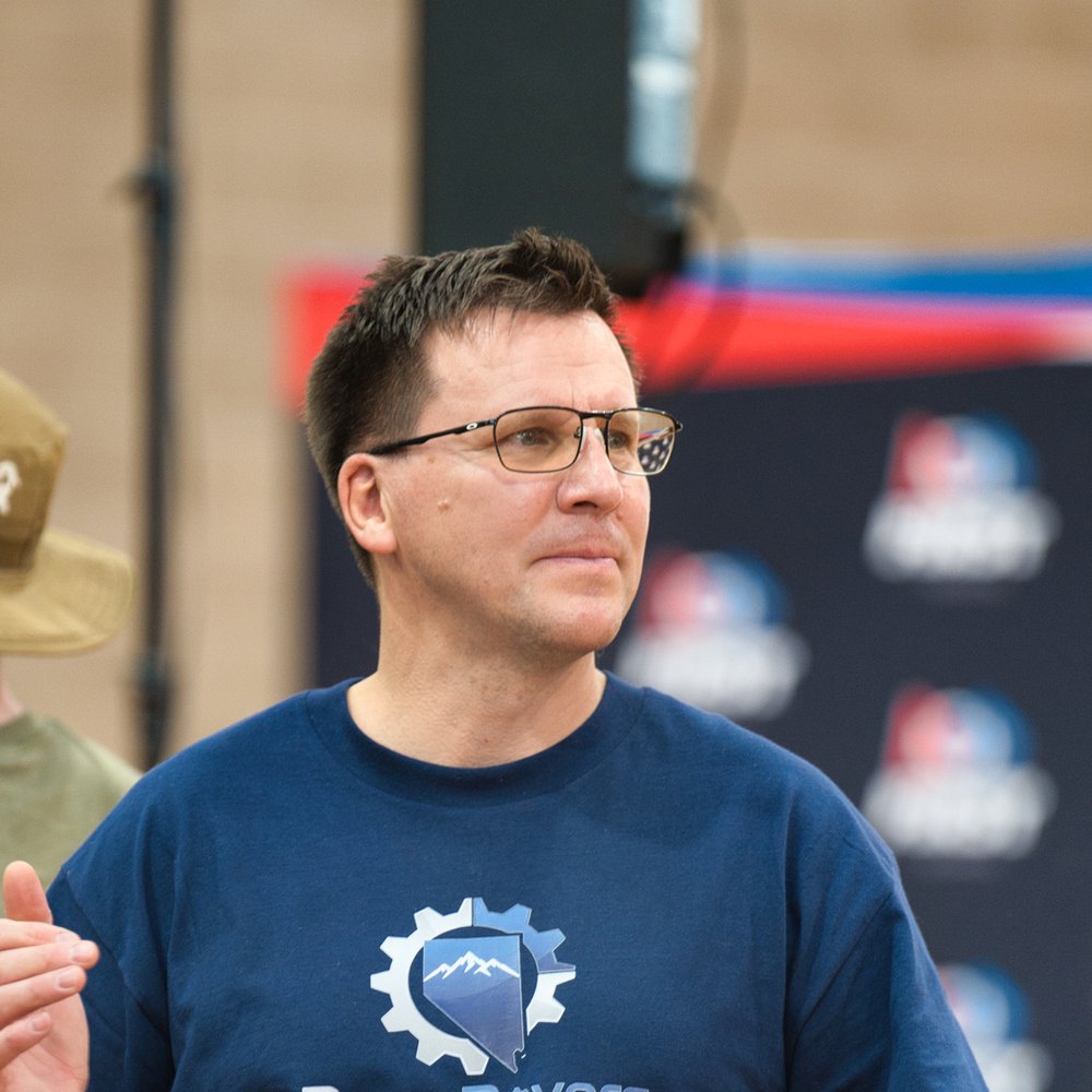 Reno Rovers lead coach wearing a Reno Rovers shirt at a FIRST LEGO League event