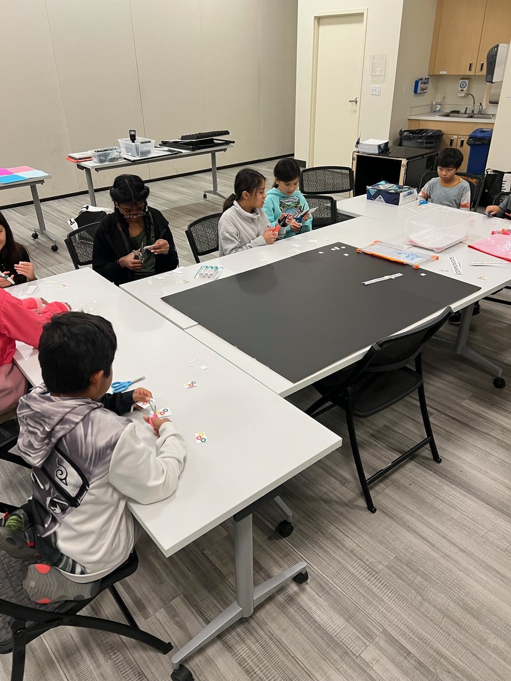 Reno Rovers students seated around practice tables in a classroom
